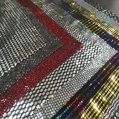 Fabraic sequin óir súilíneach